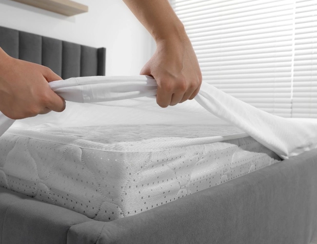 Bed cover laundry service in NJ for student housing bedding, blankets, linens, and towel care