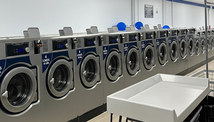 Commercial front load washing machines processing bulk laundry for NJ households and businesses