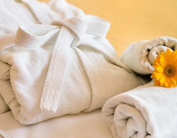 Professional laundry cleaning service for spa towels robes sheets and linens across New Jersey