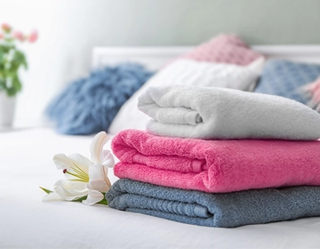 Fresh soft towels cleaned using professional laundry washing service across New Jersey