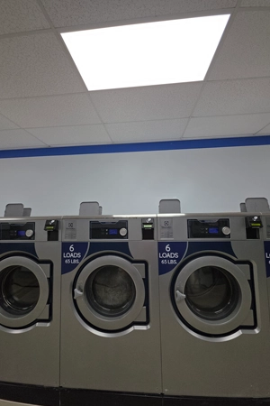 High capacity washing machine used in professional laundry processing facility across New Jersey