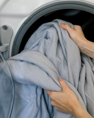 Blanket laundry cleaning service for student housing with bedding, linens, bath towels