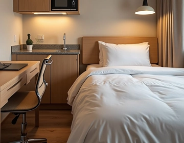 Extended stay hotel laundry service for guest linens, bedding, bath towels, and staff uniforms