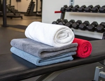 Gym towel laundry service in NJ for fitness centers with clean workout towels and cleaning cloths