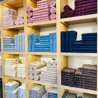 Freshly washed and neatly stacked business towels prepared for routine delivery to a commercial client